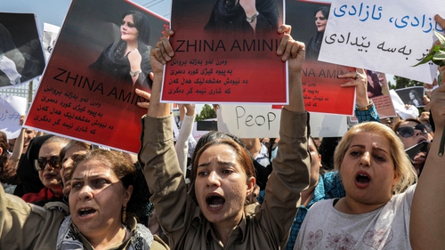 Women attend a protest outside the UN offices in Arbil, the capital of Iraq's autonomous Kurdistan region