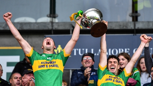 Joint-captains Darren Garry, left, and Niall McNamee lift the trophy
