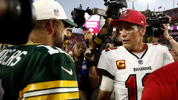 Aaron Rodgers (L) and Tom Brady greet each other after the game
