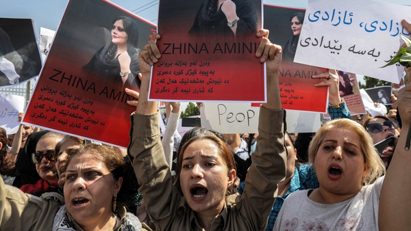 Women protest outside the UN office in Arbil, the capital of Iraq's autonomous Kurdistan region over the death of Mahsa Amini
