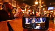 People having a drink in O'Donoghues Bar in Dublin as the Budget is announced