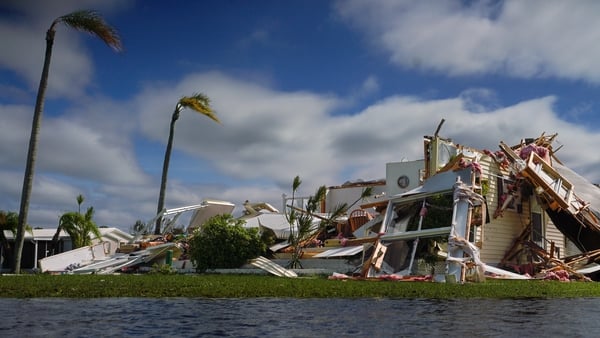 A collapsed building near a flooded river - the aftermath in Punta Gorda district of Florida