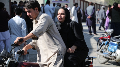 People in Kabul search for relatives after the blast