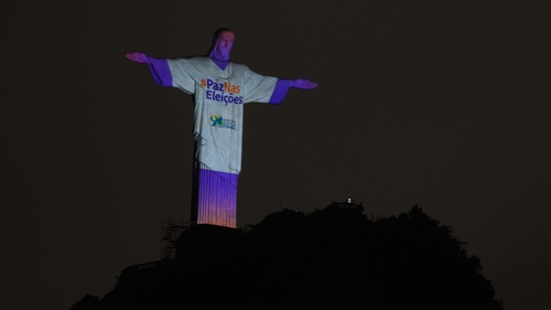 Christ the Redeemer statue is illuminated reading 'Peace in the Elections' in Rio de Janeiro