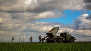 Ukrainian soldiers prepare to fire a multiple rocket launcher towards Russian positions in the southern Donetsk region
