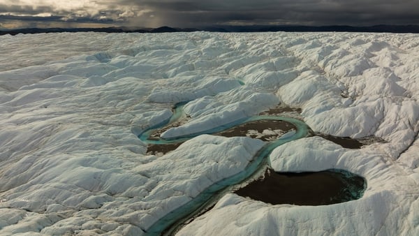 An aerial view of meltwater lakes formed at the Russell Glacier in Greenland in August this year