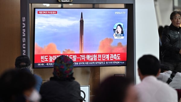 People watch a news broadcast showing file footage of a North Korean missile test, at a railway station in Seoul, South Korea today