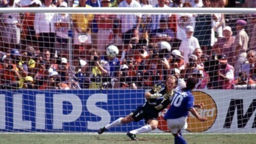 Italy's Roberto Baggio shoots over the goal of Brazil's Claudio Taffarel in the 1994 World Cup final