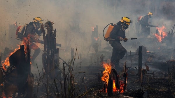 Firefighters tackle blazes in the Amazon