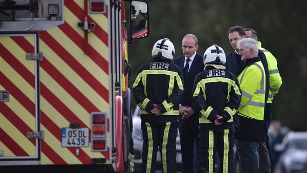 Taoiseach Micheál Martin talks to emergency workers this evening at the scene of the Applegreen service station explosion
