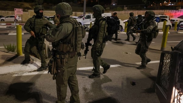 Israeli security forces deploy near the scene of the checkpoint attack