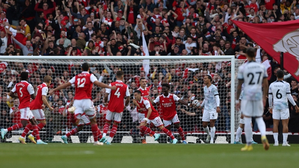 Arsenal's Brazilian midfielder Gabriel Martinelli (c) celebrates scoring