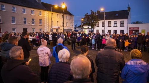 Crowds gather for a vigil in Castlefinn on Sunday evening