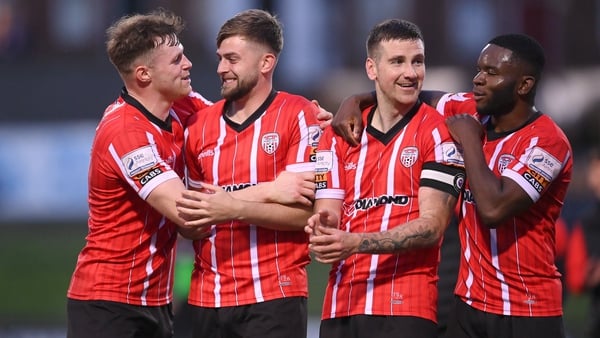 Cameron McJannet, Will Patching, Patrick McEleney and James Akintunde celebrate after the quarter-final win over Shamrock Rovers