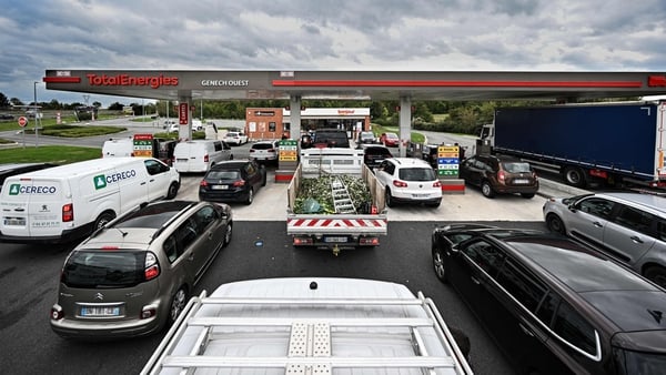 Drivers lining up as they wait at a TotalEnergies forecourt in Genech in northern France