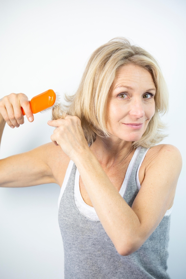 woman brushing her hair