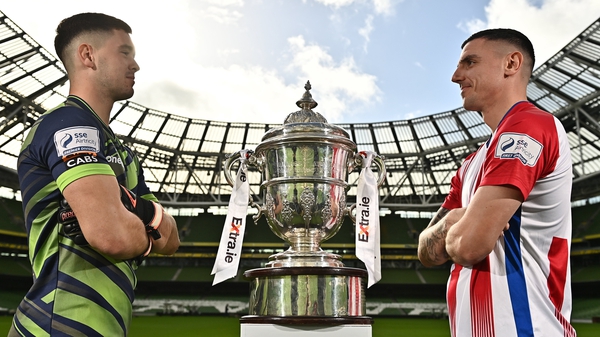 Brian Maher and Enda Curran face off with the famous old trophy at the Aviva Stadium