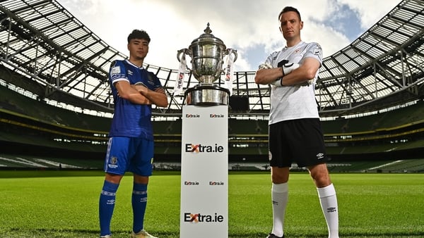 Phoenix Patterson of Waterford and Shelbourne goalkeeper Brendan Clarke pose with the FAI Cup ahead of Sunday's semi-final