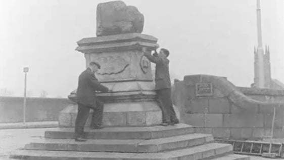 Repairs are made to the Limerick Treaty Stone in 1962.