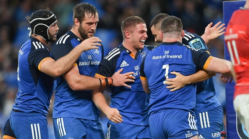 Leinster's players congratulate Scott Penny after he scored the game's opening try