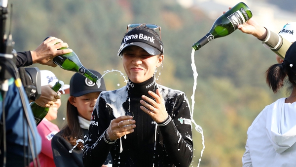 Lydia Ko is drenched in champagne after her victory