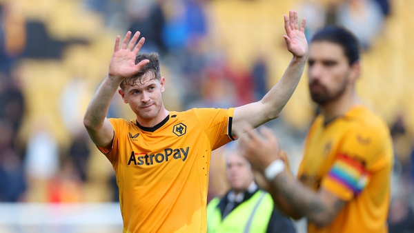 Nathan Collins holds his hands up to the Wolves fans after the game
