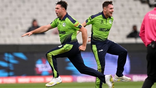 Fionn Hand (left) celebrates his wicket of Ben Stokes with team-mate Josh Little
