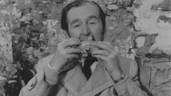 Cork actor James N Healy eats a cruebeens, a traditional Cork delicacy, 1972.