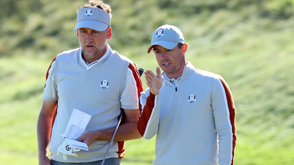 Ian Poulter (L) with Rory McIlroy