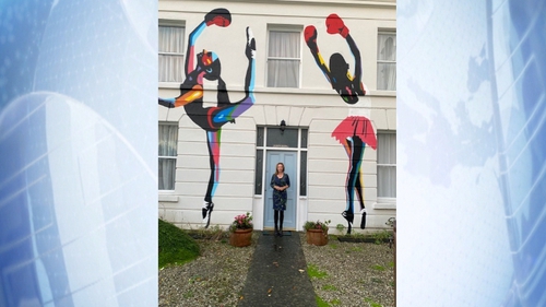 Cathy McGovern commissioned well-known street artist Solus to paint the piece 'The boxing ballerinas of Sandycove' on the front of her home last year