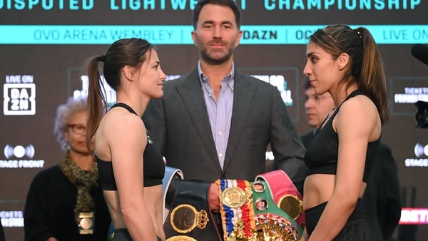 Katie Taylor (L) and Karen Elizabeth Carabajal face off at their weigh-in in London