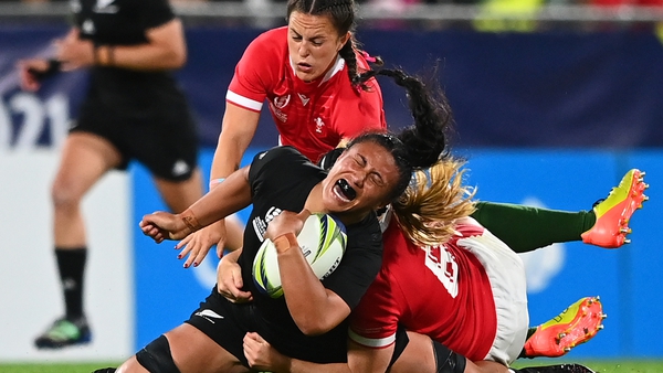 Liana Mikaele-Tu'u of New Zealand feels the heat of the Welsh defence