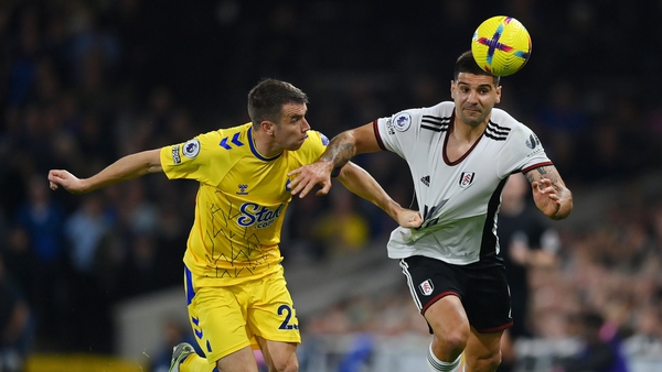Aleksandar Mitrovic of Fulham is challenged by Seamus Coleman
