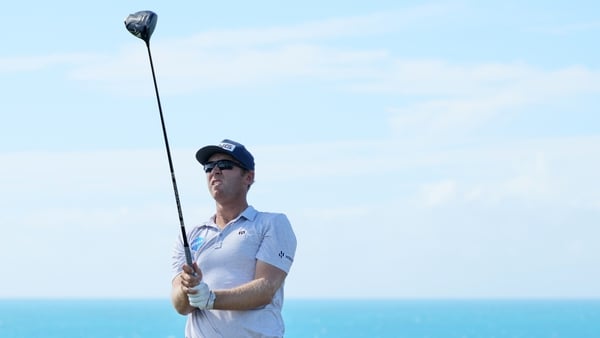 Seamus Power plays his shot from the ninth tee during the third round