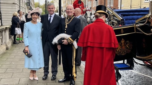 Martin Fraser and his wife Deirdre were taken to Buckingham Palace in a horse-drawn carriage