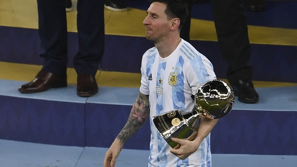 Messi holds the trophy for Best Player of the 2021 Copa America