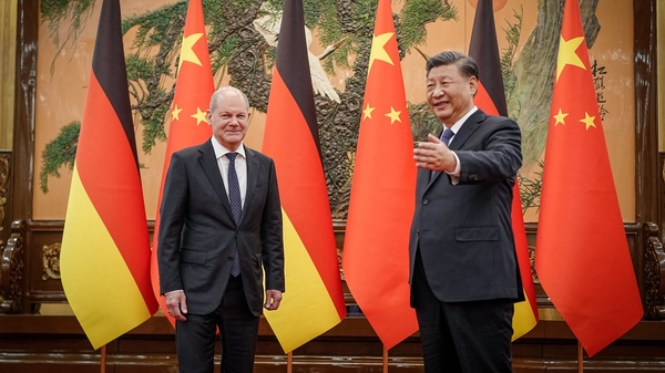 Chinese President Xi Jinping welcomes German Chancellor Olaf Scholz at the Great Hall of the People in Beijing