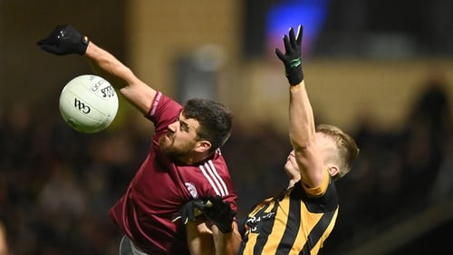 Ballybay's Drew Wylie and Crossmaglen's Rian O'Neill challenge for the ball