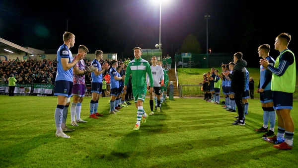 UCD players form a guard of honour for Shamrock Rovers before the match