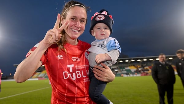 Heather O'Reilly celebrates winning the cup with her son Jack