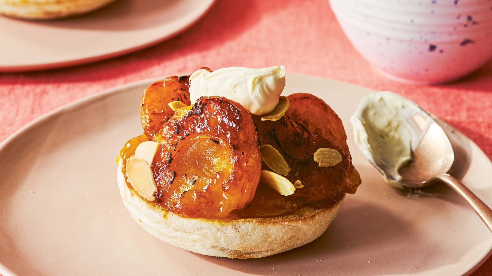 Apricots and clotted cream on English muffin