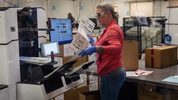 Election workers sort ballots at the Maricopa County Tabulation and Election Centre in Phoenix, Arizona
