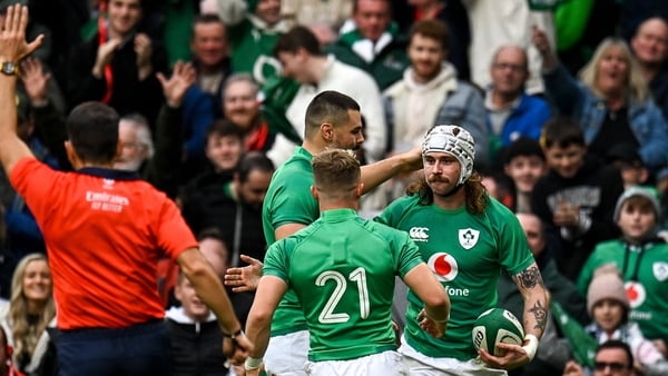 Mack Hansen (right) is congratulated after scoring Ireland's fourth try