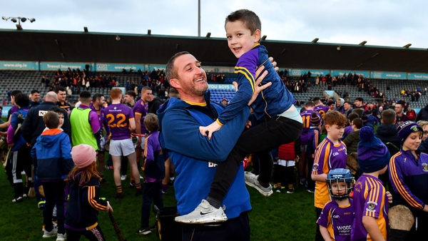Kilmacud Crokes manager Donal McGovern celebrates with his son Seán, aged 6, after his side's victory over Clough Ballacolla