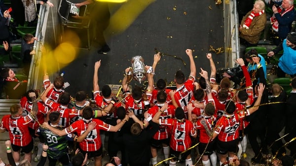 Derry City players lifting the FAI Cup after a 4-0 demolition of Shelbourne