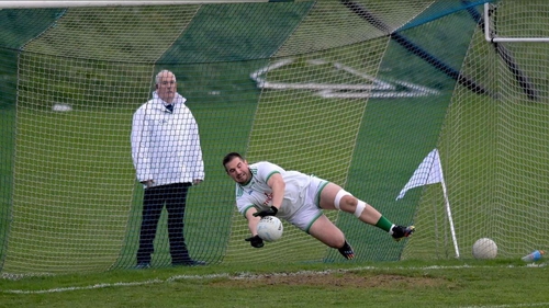 Cargin goalkeeper John McNabb makes one of his two penalty saves against Naomh Conaill. Picture credit: Twitter/@AontroimGAA
