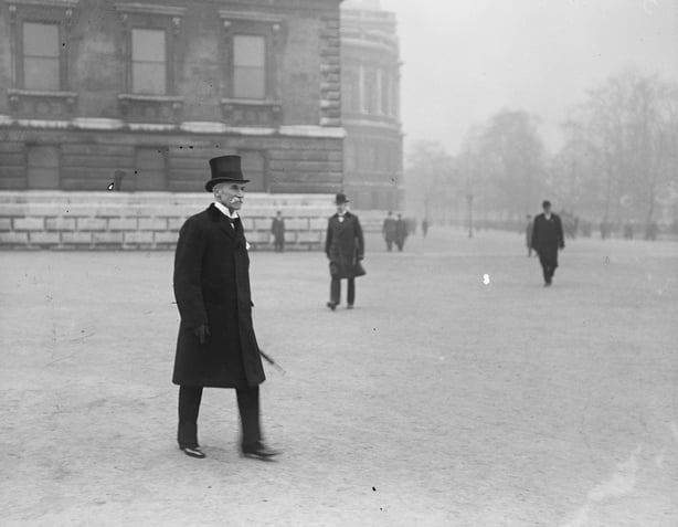 Lord Lansdowne, an elderly man in a top hat, walking towards a car. Photograph taken in 1916 Photo by Topical Press Agency/Getty Images)