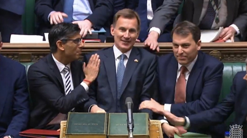 Prime Minister Rishi Sunak congratulates Chancellor of the Exchequer Jeremy Hunt after he delivered his autumn statement to MPs in the House of Commons