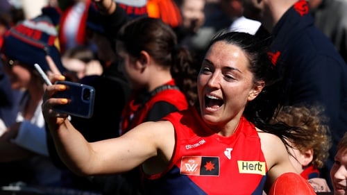 Sinead Goldrick celebrates with Melbourne fans after the second preliminary final win