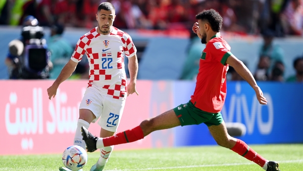 Josip Juranovic of Croatia battles for possession with Noussair Mazraoui